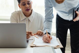 Bearded Man Signing a Paper